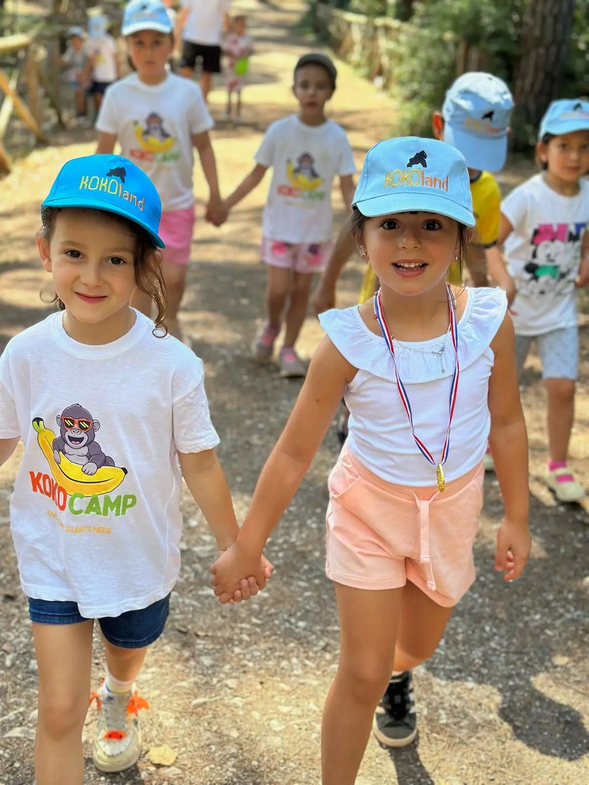 Two girls holding hands at KokoCamp