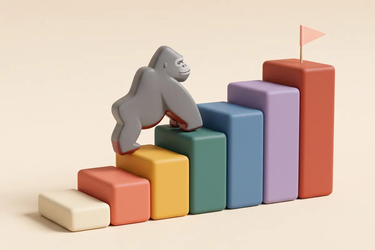 Scala di blocchi giocattolo colorati che sale gradino dopo gradino, con KOKO il gorilla che si arrampica verso l’alto