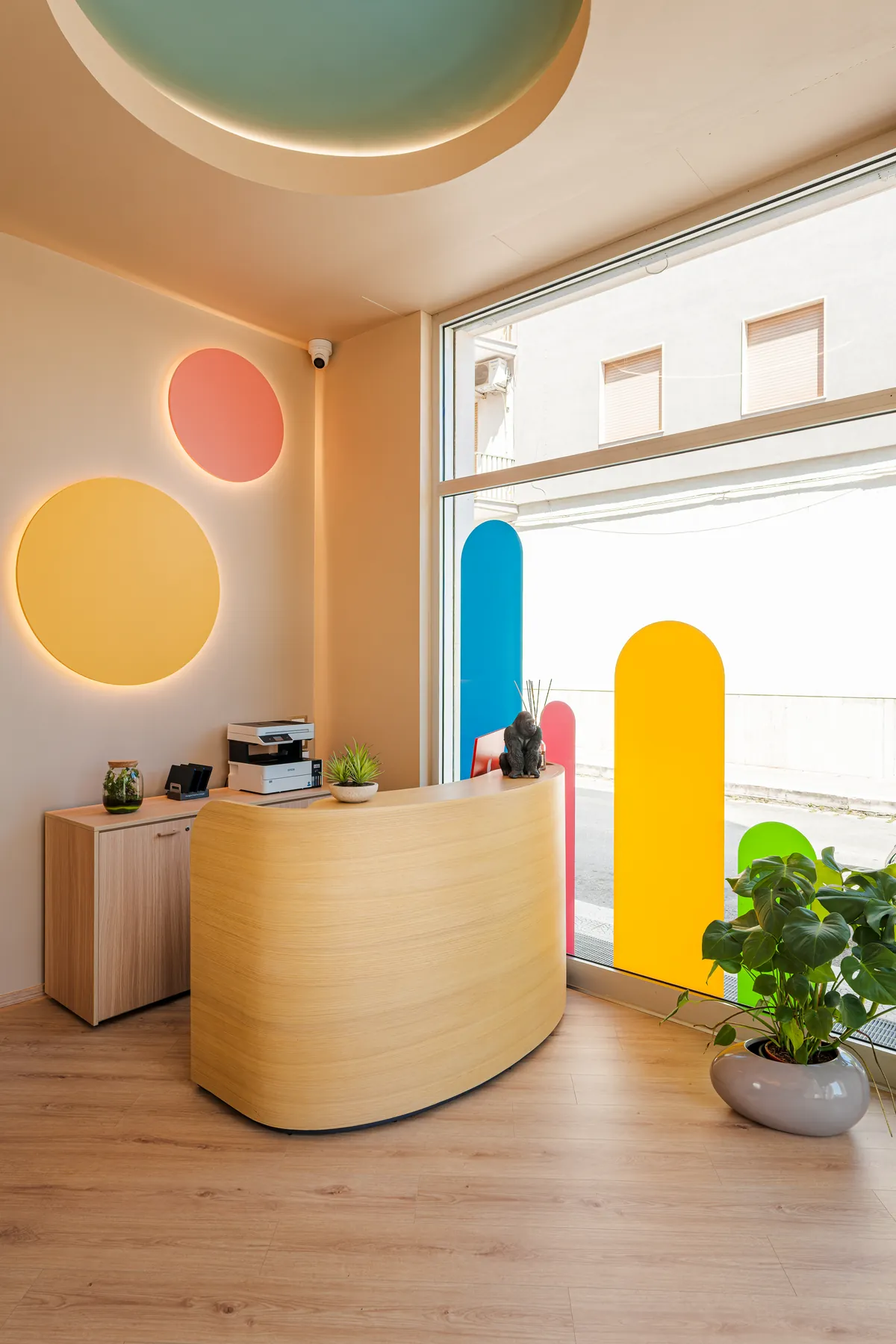 The KOKOland Monopoli welcome desk in front of the colourful window
